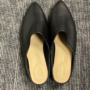 Clarks size 9 black leather slip on mules.